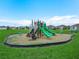 Community playground has multiple slides, spring riders and a bench at 440 Patricia Alford Dr, Haines City, FL 33844