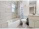 Modern bathroom with tiled walls, shower-tub combination, and vanity with sink at 4546 Malibu St, Orlando, FL 32811