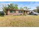 Charming single-story home with a well-maintained lawn and a classic neutral-toned exterior at 4546 Malibu St, Orlando, FL 32811
