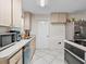 Well-lit kitchen featuring sleek countertops, modern appliances, and ample storage at 4546 Malibu St, Orlando, FL 32811