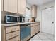 Updated kitchen features modern appliances, countertop, and ample cabinet space at 4546 Malibu St, Orlando, FL 32811