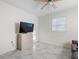 Cozy living room features a mounted TV, beige table and plenty of natural light at 4546 Malibu St, Orlando, FL 32811