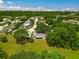 Aerial view of the home and surrounding neighborhood, highlighting the backyard and screened patio area at 4901 Lindsay Ct, Orlando, FL 32821