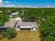 Aerial view showcases the house and neighborhood, highlighting the lush greenery and community layout at 4901 Lindsay Ct, Orlando, FL 32821