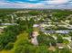 Discover the charm of this neighborhood in an aerial view featuring residences and mature landscaping at 4901 Lindsay Ct, Orlando, FL 32821