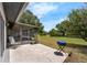 Landscaped backyard with large screened lanai and a patio with space for grilling at 4901 Lindsay Ct, Orlando, FL 32821