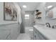 Bright bathroom features a vanity with modern fixtures, a tub with shower, and stylish tile surround at 4901 Lindsay Ct, Orlando, FL 32821