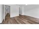 Spacious room with wood-look vinyl flooring, white walls and trim with ample natural light at 4901 Lindsay Ct, Orlando, FL 32821