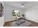 Bright bedroom with a home office, large window with neighborhood view, and double-door closet at 4901 Lindsay Ct, Orlando, FL 32821