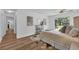 Well-lit bedroom featuring a king bed, modern decor, and direct access to a beautiful backyard at 4901 Lindsay Ct, Orlando, FL 32821