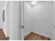 Clean and well-lit hallway with neutral walls, showing access to other parts of the home at 4901 Lindsay Ct, Orlando, FL 32821