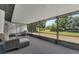 Relax on the screened lanai overlooking the lush green backyard and adjacent to the sliding glass door at 4901 Lindsay Ct, Orlando, FL 32821