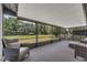 Enjoy relaxing outdoor space on this screened lanai with views of the lush, green backyard at 4901 Lindsay Ct, Orlando, FL 32821