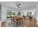 Open living and dining area with sliding glass doors leading to outdoor screened-in patio at 4901 Lindsay Ct, Orlando, FL 32821