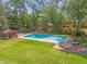 Scenic aerial view of the sparkling community pool, showcasing its pristine landscaping and serene surroundings at 5 W Village Dr, Oviedo, FL 32765