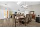 View of dining room with pendant lighting and seamless connection to living spaces at 5 W Village Dr, Oviedo, FL 32765