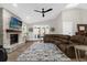 Spacious living room featuring a fireplace, vaulted ceiling, and ample seating at 5 W Village Dr, Oviedo, FL 32765