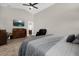 Comfortable main bedroom with a high ceiling and modern décor, dresser, TV and seating at 5 W Village Dr, Oviedo, FL 32765
