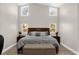 A tranquil main bedroom with high ceilings, four windows, neutral tones, and a cozy sitting area at 5 W Village Dr, Oviedo, FL 32765
