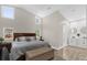 A well-lit main bedroom with high ceilings and windows with an attached bathroom at 5 W Village Dr, Oviedo, FL 32765
