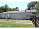 Back of the home with a yard and space for recreation at 5054 Mcdonald Rd, Zellwood, FL 32798