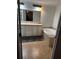 Bright bathroom featuring a soaking tub, vanity with cabinet storage, and a large mirror at 5054 Mcdonald Rd, Zellwood, FL 32798