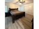 Bedroom with a bed, closet, and hard surface flooring at 5054 Mcdonald Rd, Zellwood, FL 32798