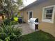 Outdoor patio with stainless steel BBQ grill and garden at 563 Pleasant Grove Dr, Winter Springs, FL 32708