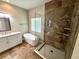 Bright bathroom featuring a soaking tub and a luxurious tiled shower with glass door at 563 Pleasant Grove Dr, Winter Springs, FL 32708