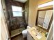 Modern bathroom with a glass-enclosed shower and neutral-toned vanity at 563 Pleasant Grove Dr, Winter Springs, FL 32708