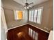 Bedroom featuring hardwood floors, neutral walls, shutters on the windows and ceiling fan at 563 Pleasant Grove Dr, Winter Springs, FL 32708