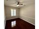 Bedroom featuring hardwood floors, a ceiling fan, and natural light at 563 Pleasant Grove Dr, Winter Springs, FL 32708