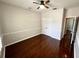 Cozy bedroom with hardwood floors, ceiling fan and closet at 563 Pleasant Grove Dr, Winter Springs, FL 32708