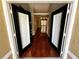 Inviting entryway featuring hardwood floors and a view of the house's interior at 563 Pleasant Grove Dr, Winter Springs, FL 32708