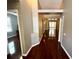 Hallway featuring hardwood floors and neutral colored walls at 563 Pleasant Grove Dr, Winter Springs, FL 32708