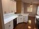 Modern kitchen with white cabinets, stainless appliances, and a breakfast bar at 563 Pleasant Grove Dr, Winter Springs, FL 32708