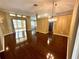 Living room with gleaming hardwood floors and lots of natural light at 563 Pleasant Grove Dr, Winter Springs, FL 32708