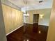 Open concept living room featuring hardwood floors, neutral paint and decorative lighting at 563 Pleasant Grove Dr, Winter Springs, FL 32708
