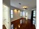Spacious main bedroom with hardwood floors, walk-in closet and access to ensuite bathroom at 563 Pleasant Grove Dr, Winter Springs, FL 32708