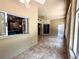 Enclosed sun room with tiled floor and multiple windows leading to the yard at 563 Pleasant Grove Dr, Winter Springs, FL 32708