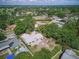 A nice aerial view of a neighborhood featuring a home with a neutral-colored roof and a spacious, private backyard at 6327 Ridgeberry Dr, Orlando, FL 32819
