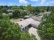 Aerial view of the home showcasing a tiled roof and well-manicured landscaping at 6327 Ridgeberry Dr, Orlando, FL 32819