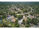 Aerial view of neighborhood with mature trees and well-maintained homes at 6327 Ridgeberry Dr, Orlando, FL 32819