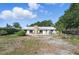 Expansive backyard featuring an outdoor grill and a stone chimney, perfect for entertaining and relaxing at 6327 Ridgeberry Dr, Orlando, FL 32819