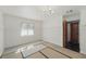 Bedroom with a window overlooking the outside, detailed wall moulding, and hardwood floors at 6327 Ridgeberry Dr, Orlando, FL 32819