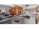 Spacious living room with modern decor, wooden cabinetry, and seating, seamlessly connecting the spaces at 6327 Ridgeberry Dr, Orlando, FL 32819