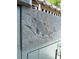 Carved fish detail on the exterior kitchen cabinet at 6327 Ridgeberry Dr, Orlando, FL 32819