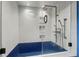 Modern shower with a blue basin, glass enclosure, and sleek fixtures at 6327 Ridgeberry Dr, Orlando, FL 32819