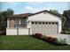 Charming single-story home features a two car garage, neutral color palette and well-manicured lawn at 658 Pennywort St, Lake Alfred, FL 33850