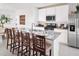 Bright kitchen features stainless steel appliances, granite countertops, and a breakfast bar with seating at 658 Pennywort St, Lake Alfred, FL 33850